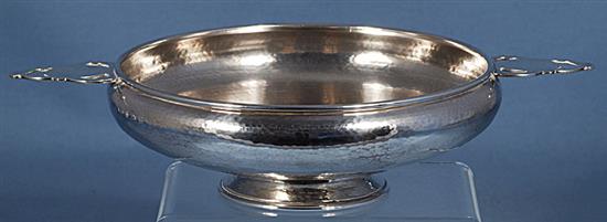 A George V Arts & Crafts silver bowl, by Albert Edward Jones, Diameter to handles 281mm, weight 9.8oz/305grms